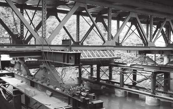 After hydraulic jacks raised up the old bridge on the Oregon project, it was slid sideways onto temporary piers.