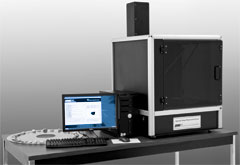 Photograph showing the AIMS tabletop equipment. A Technology Partnerships grant is aiding the development of AIMS, a new device to characterize aggregates used in paving materials.