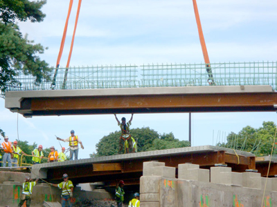 Crews used accelerated bridge construction techniques to replace 14 bridge superstructures in one summer in a Massachusetts Highways for LIFE project.