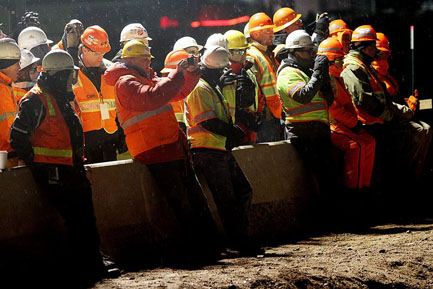 Transportation professionals from around the world snap photos of the historic bridge move.