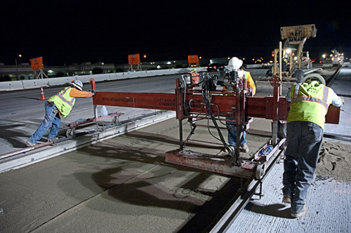 Crews prepare to install precast slabs on a California road rehabilitation project.