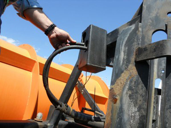 A box made to hold hydraulic hoses reduces fluid spills when staff are working on equipment. It has been replicated more than 280 times across Colorado DOT maintenance patrols.