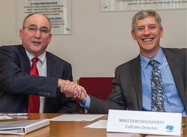 FHWA Administrator Gregory Nadeau (left) was on hand when California Department of Transportation Director Malcolm Dougherty signed the state’s STIC charter.