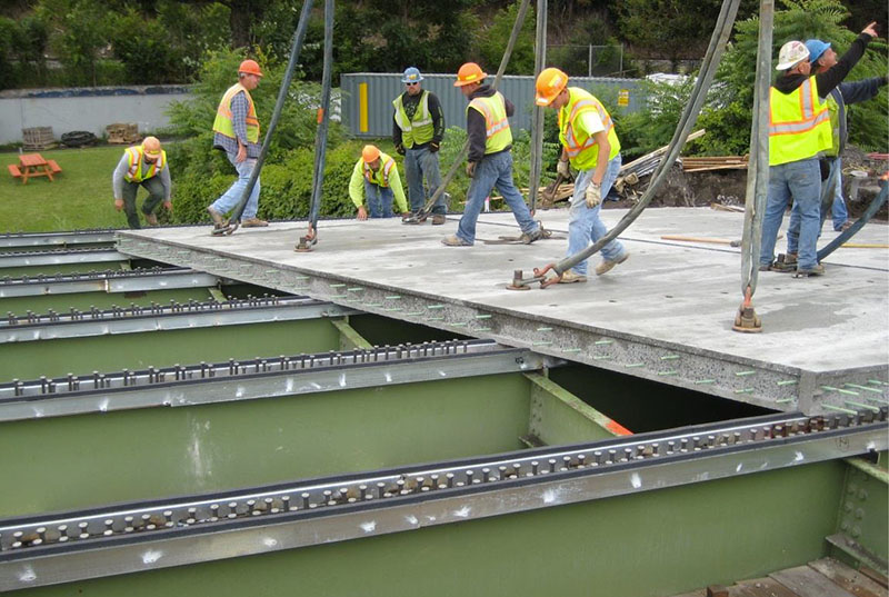 Photo of workers constructing a bridge deck.