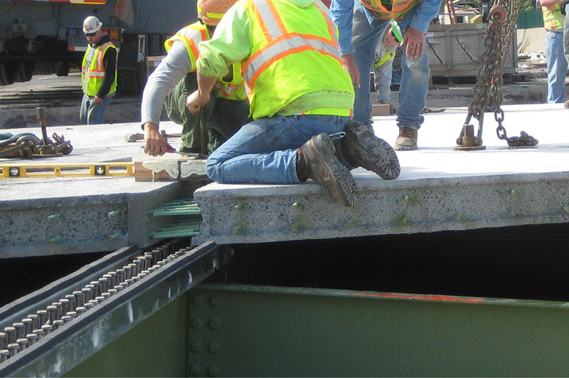 Photo of workers constructing a bridge deck.