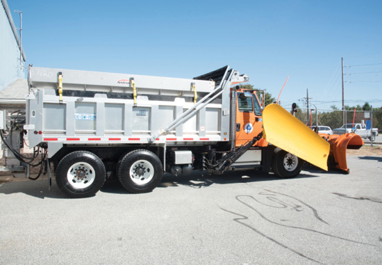 Photos of snowplow with mirror mounted on plow.