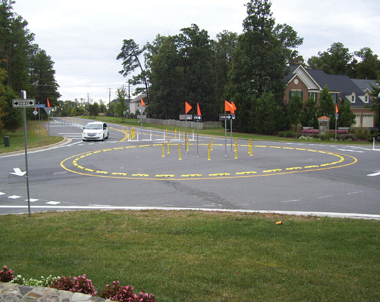 Photo of car traveling on roundabout made with off-the-shelf materials.