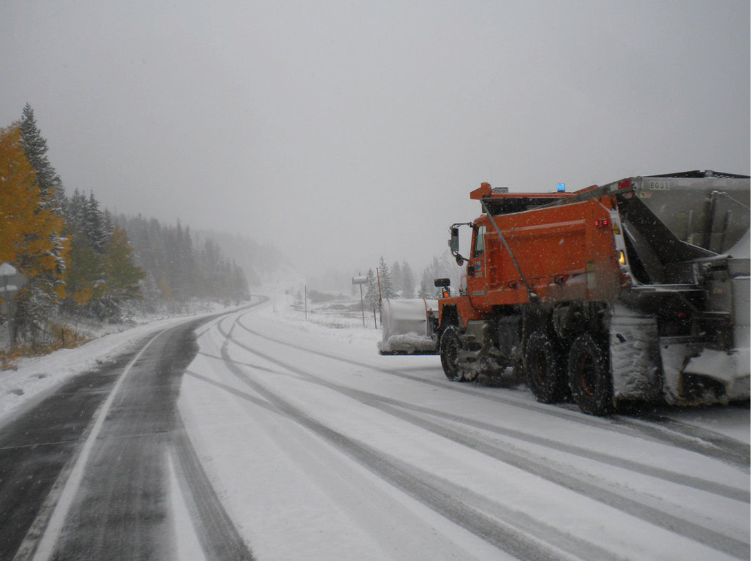 snowplow on snowy road