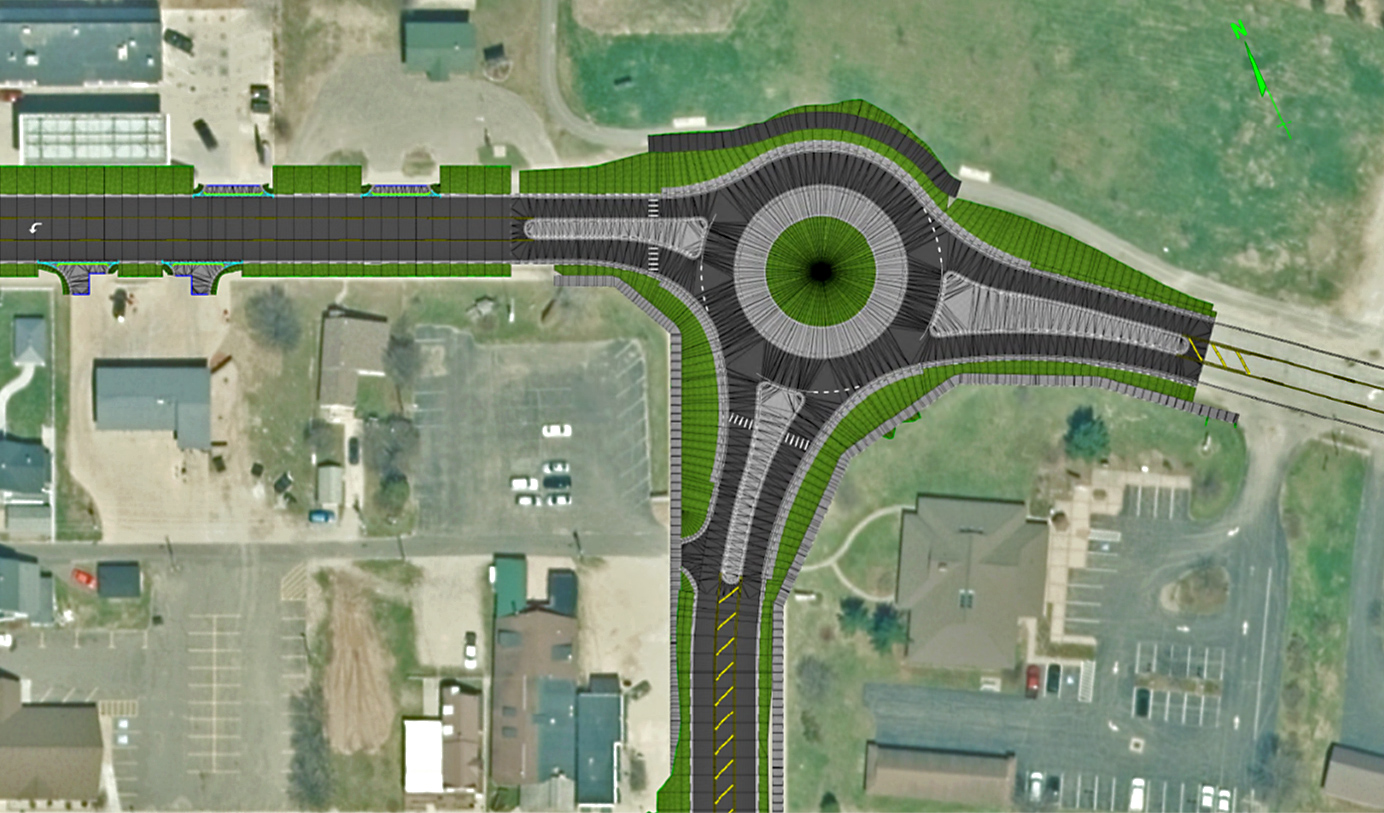 An aerial map of the location in Munising where a new roundabout was proposed. The roundabout design is drawn using computer software over the existing intersection.