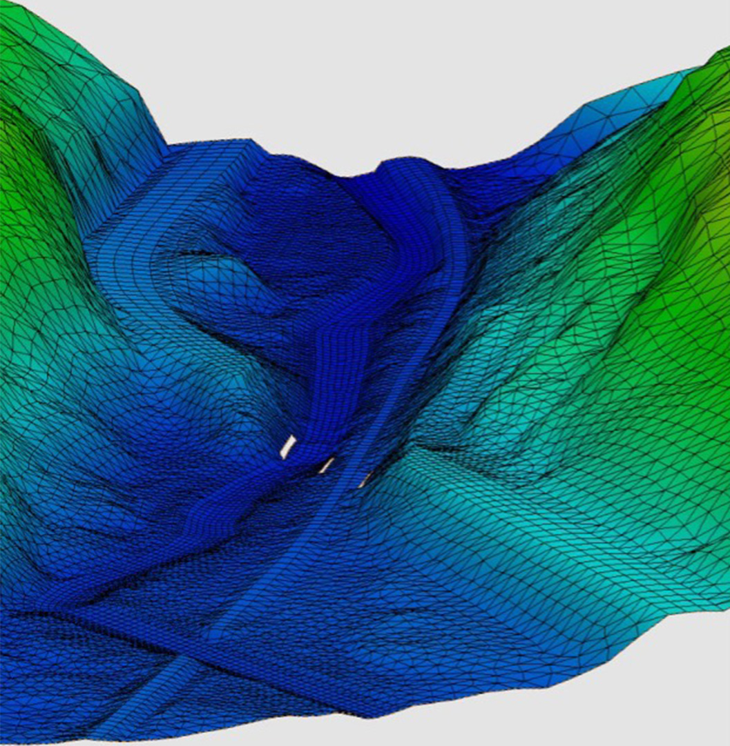 A 2D model that uses mesh to represent terrain at a road crossing of a river and a railroad in Vermont.