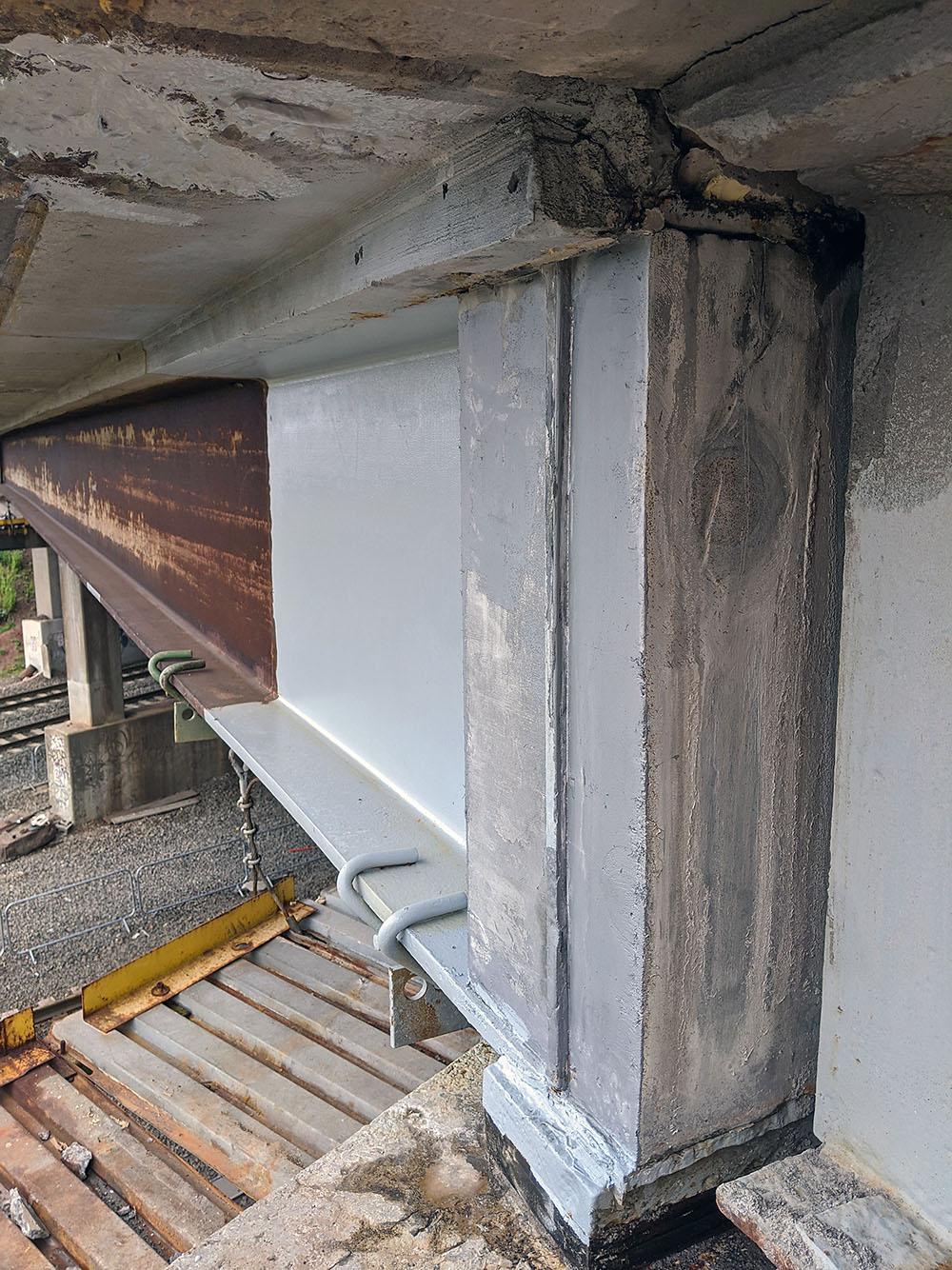 bride beam end repair with welded shear connectors to the UHPC