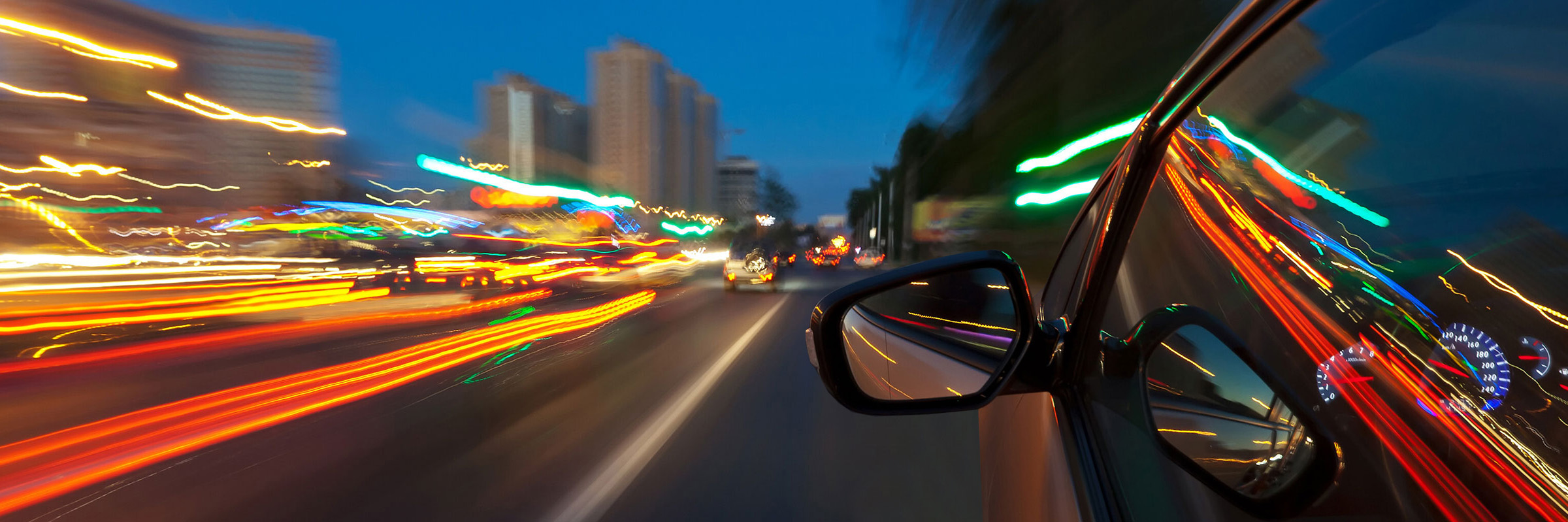 blurry cars zooming on a highway