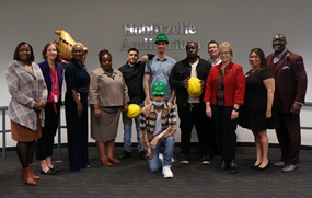 Group of workers posing for festive picture