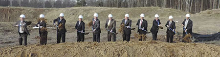 Groundbreaking photo, suited men in hardhats