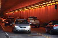 Photo. View of traffic coming out of a tunnel.