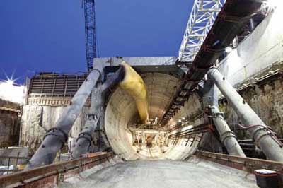 Photo. Night view of the Port of Miami Tunnel entrance under construction.