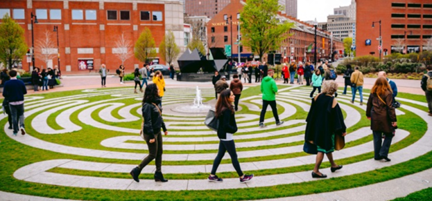 People walking in the Labyrinth, a feature in the Armenian Heritage Park in the Rose Kennedy Greenway