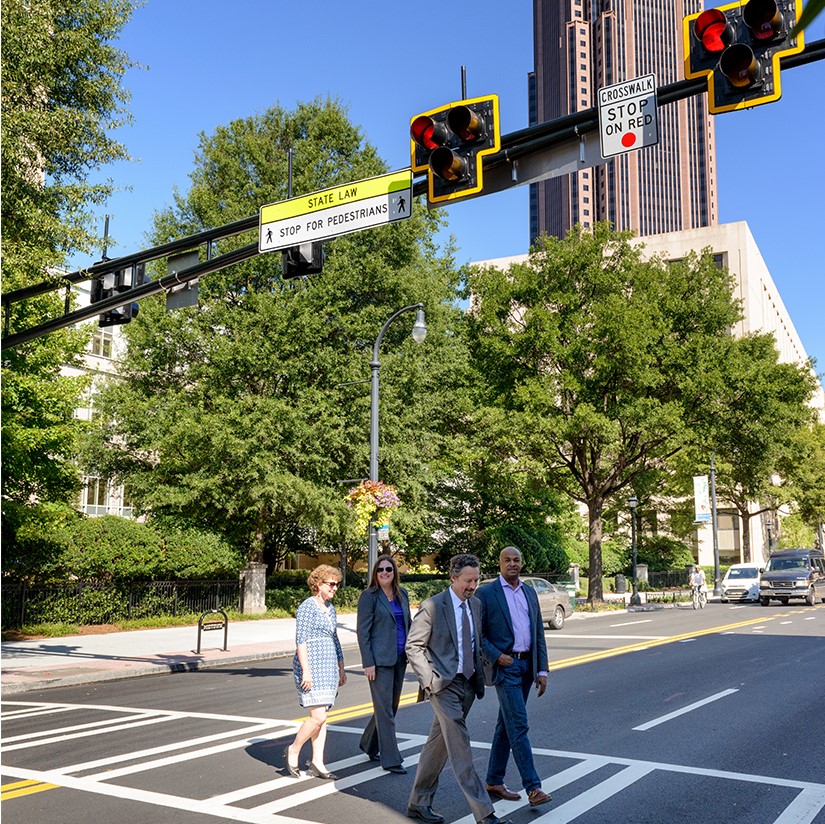 Pedestrians using crosswalk.