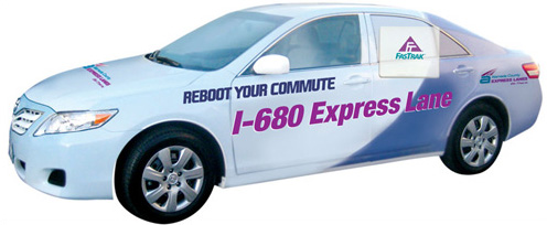 Car with "Reboot Your Commute I-680 Express Lane painted on it