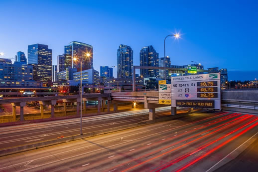 freeway and city skyline at night