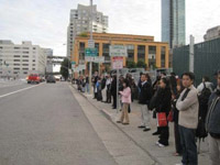 Photo: people at bus stop