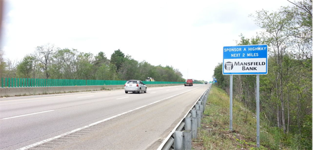 Mansfield Bank Sponsor-a-Highway sign on a stretch of Massachusetts highway.