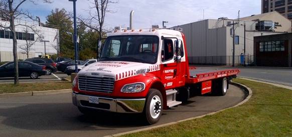 Highway assistance patrol truck sponsored by MAPFRE Insurance.
