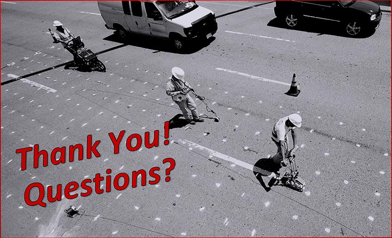 This slide shows a black-and-white image of a bridge deck with four lanes. The two left lanes (in the direction of traffic) show vehicles, and the two right lanes are closed and workers are taking measurements with hand-held nondestructive evaluation tools. The lanes with traffic and the lanes with workers are separated by a traffic cone. The lanes with workers have white dots on a 2-foot by 2-foot grid painted on the top of the concrete bridge deck.