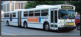 Picture 3. Graphic. The picture shows a single articulated metro bus driving on a roadway.