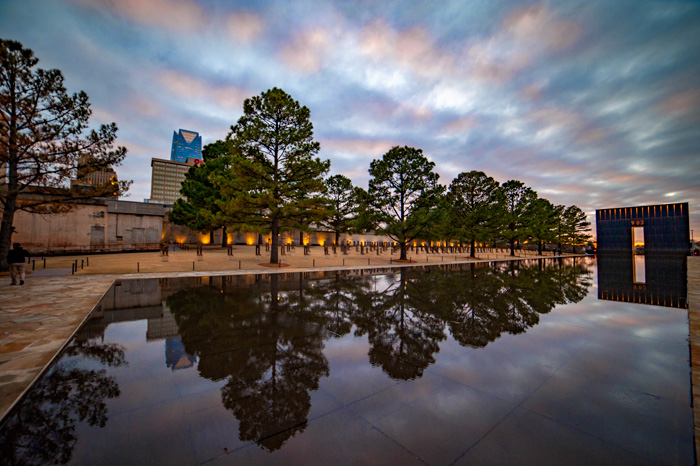 Photo: Field of Empty Chairs, Rreflecting Pool, and 9:03 Gate