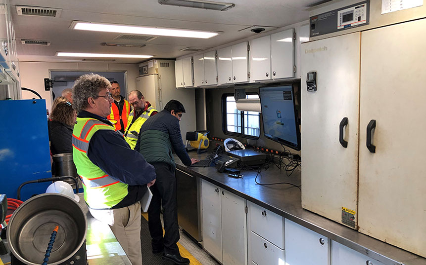 roup of workers inside a mobile technology center