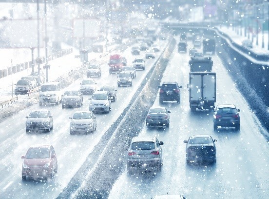 Highway traffic with rain or snow.
