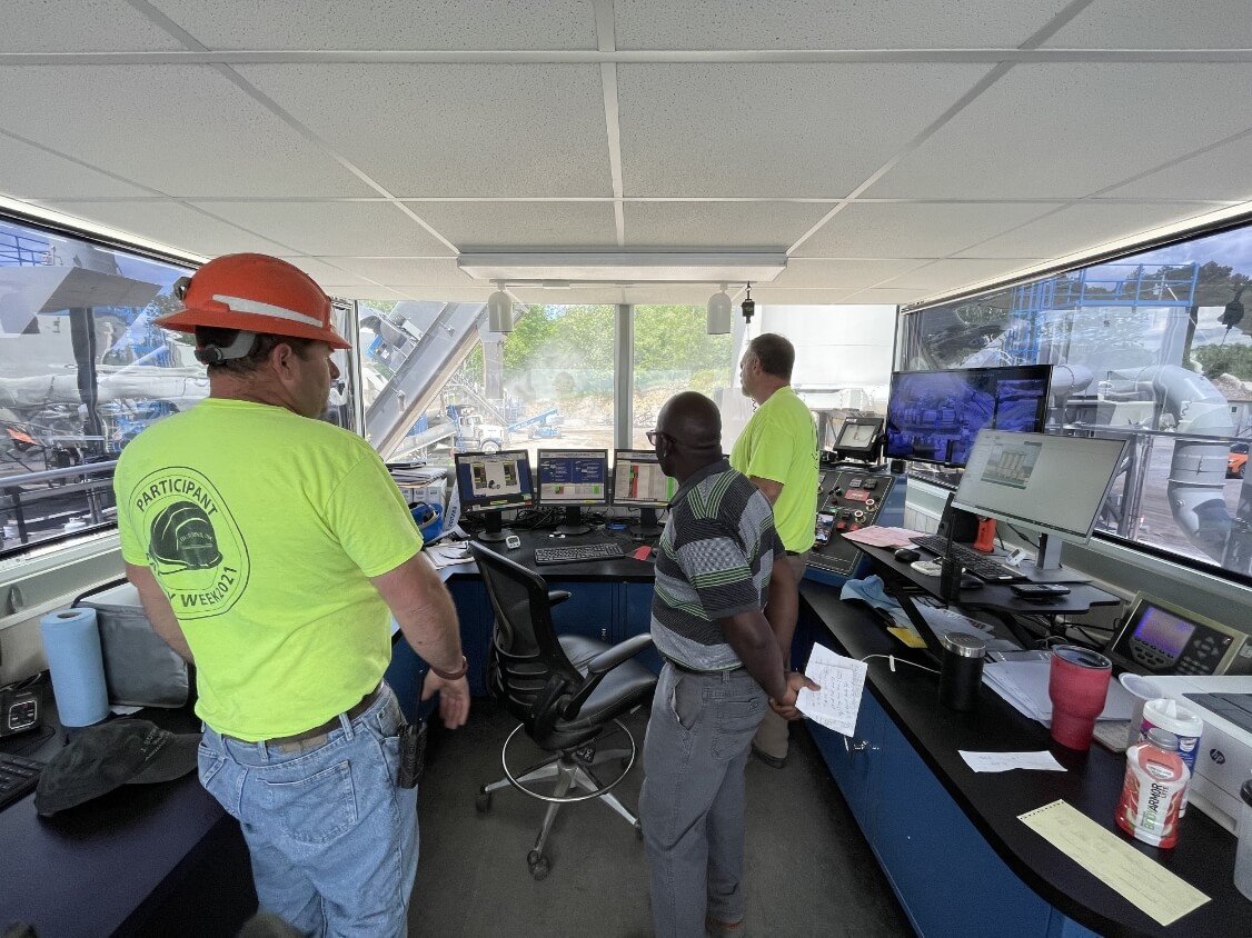 Image of MATC team on a site visit in a control room