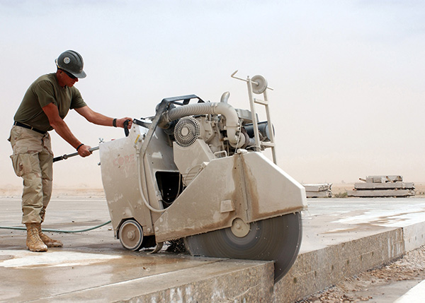 Sawing  concrete before the concrete has developed too much strength. 