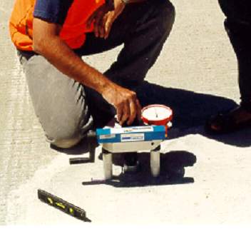 Photo: Commercially Available Tensile Bond Strength Test Device as described above