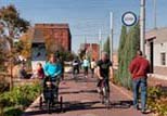 People walking and biking along the Indianapolis Cultural Trail.