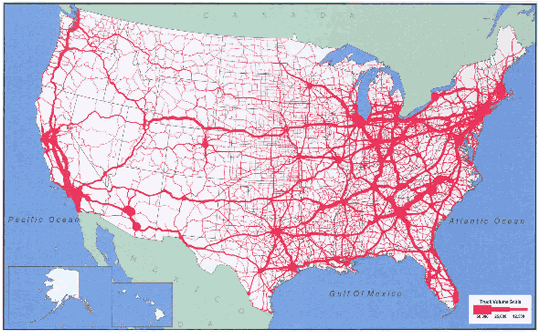 Map of the continental United States showing the national highway system as a dense network in the year 1998. Density of daily truck traffic is indicated by thickness of line. The network is heaviest along the east coast into the Midwest. Three large dense arteries cross the plains to the West coast, which has very heavy density in central and southern California and somewhat heavy density in the Pacific Northwest states.