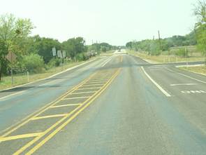 2 thru lanes with a striped island