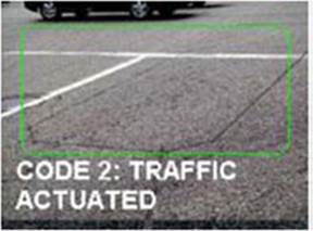 Road surface close up showing lines in pagement for detectors.