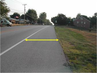 Figure 4.57 shows the appropriate limits for the measurement of a bituminous shoulder on a given section of road.  The width is to be measured from the outer edge of the roadway (i.e. stripe) to the edge of the paved area.