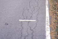 Figure 4.83 shows an example of moderate severity fatigue type cracking on a roadway with an asphalt-concrete (AC) surface.