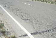 Figure 4.84 shows an example of high severity fatigue type cracking on a roadway with an asphalt-concrete (AC) surface.