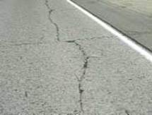 Figure 4.92 shows an example of high severity longitudinal cracking on a roadway with a jointed concrete pavement (JCP) surface.