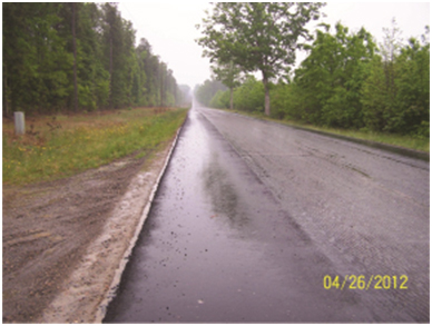 Overall View of Roadway Facing East. This photo, taken by a contractor as part of a service call, shows the roadway in question and illustrates the fact that it is being milled and resurfaced.