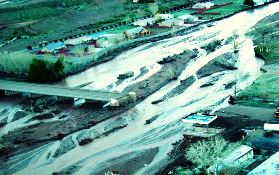 Damage to the Beaver Dam Wash Bridge following heavy floods in January 2005. A bridge that is missing an entire section due to flood damage.