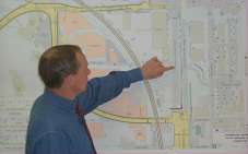 Photo: Man looking at plans