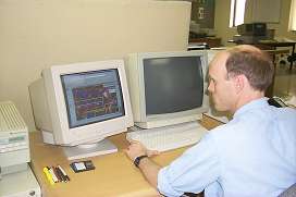 Photo: Man working at a computer