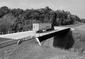 Photo of truck crossing a bridge