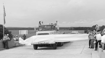 Photo of truck breaking ribbon at the I-40 reopening