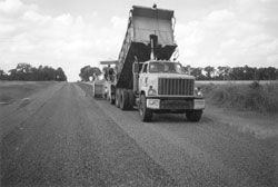 Photo of truck dumping on a road